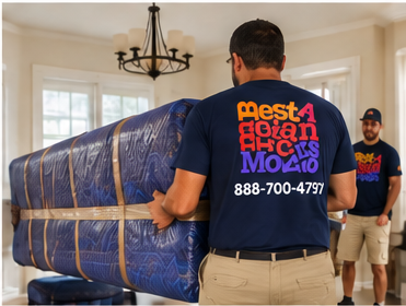 Two movers carrying a blanket-wrapped sofa through a hallway